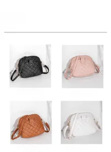 Quilted shell-shaped shoulder bags displayed in black, pink, brown, and white colors