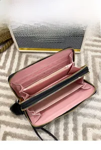 Detailed interior of long wallet showing 12 card slots and large capacity storage compartments