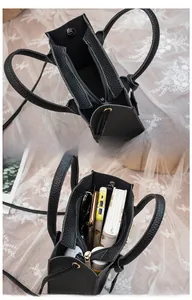 Internal view showing capacity of litchi grain tote bag with smartphone and accessories