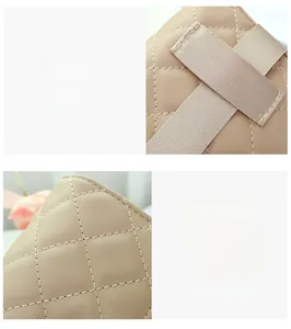 Macro detail of beige quilted embroidery pattern and precise stitching on shoulder bag