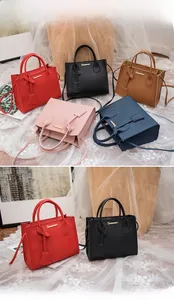 Litchi pattern leather handbag detail showing various colors and adjustable strap