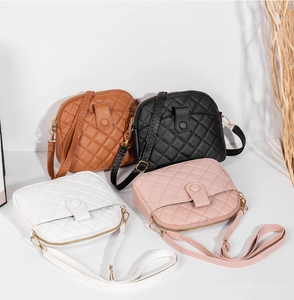 Quilted crossbody shell bags shown in brown black white and pink with zip closure