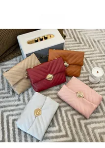 Top view of five V-quilted leather chain bags in red, brown, beige, pink and blue