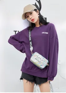 Iridescent laser crossbody bag with Little Beauty print and a black logo strap
