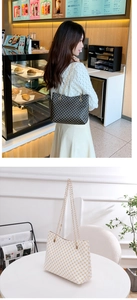 Detail view of large capacity tote bag with metal chain strap and monogram printed PU leather