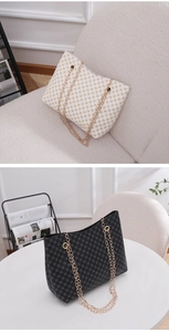 Detail of minimalist chain bucket bags with geometric prints in black and white styles