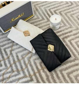 Classic quilted chain square bags in black and cream leather with gold lock detailing