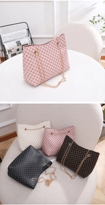 Detailed group shot of circle-patterned bucket bags in four colors with gold chains