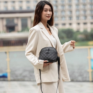 Classic black shell-shaped crossbody bag with quilted embroidery pattern for women