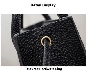 Macro shot of texture black leather bag with premium metal eyelet and hardware detail