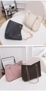 Detailed view of textured bucket bags with gold chain straps in four trendy colors
