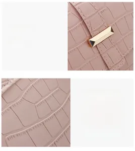 Detailed shot of pink faux crocodile leather texture and golden rectangular buckle