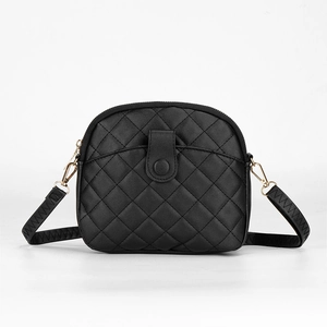 Elegant black shell shoulder bag with quilted leather texture and golden metal hardware