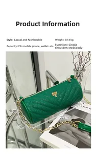 Detailed view of green quilted cylinder bag with gold tree logo and 22cm length spec