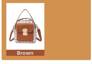 Detail of a mini plaid backpack with brown leather flap and gold metal clasp closure