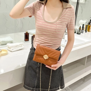 Brown quilted envelope chain bag with gold diamond turn-lock closure on modern background