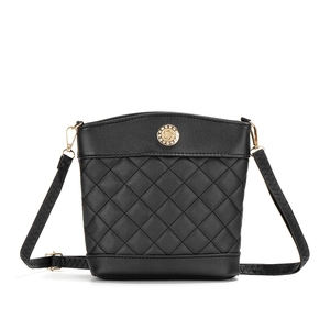 Elegant black quilted leather bucket bag with gold rhinestone emblem and adjustable strap