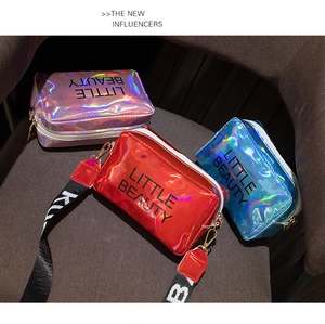 Detail of holographic laser square bags in red, blue and pink with metal buckles