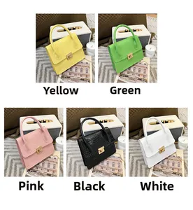 Detailed close-up of colorful crocodile pattern mini crossbody bags with gold metal clasps