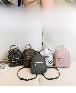 Selection of five mini PU leather backpacks featuring assorted prints and gold-tone hardware