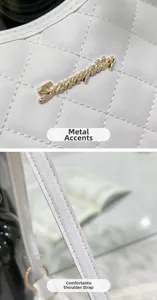 Detail of white quilted handbag showing golden logo hardware and premium stitching
