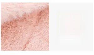 Detail of pink faux fur plush fabric texture with long fibers and soft glossy finish