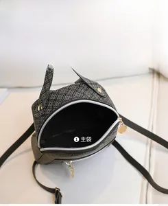 Detail view of the spacious main pocket in a patterned backpack with durable zipper