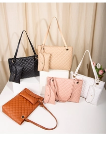 Detailed close-up of quilted tote bags in five colors with matching small pouches