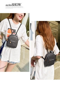 Detailed view of mini grey backpack with geometric patterns and golden metal pendant