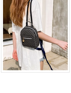 Mini backpack in dark grey with vintage geometric pattern and golden charm detail
