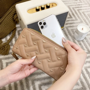Brown quilted long wallet with heart embroidery and golden zipper for women