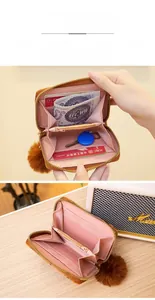 Detailed interior of brown plush wallet showing card slots and zipper coin pocket