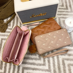 Women's heart embossed leather long wallet with wrist strap and pompom charm