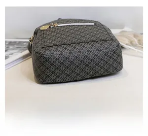 Detail of dark gray fashion backpack with geometric FASHION letter patterns and metal zipper