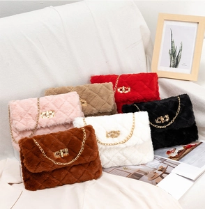 Detailed overhead shot of quilted plush crossbody bags with gold chain straps in six colors