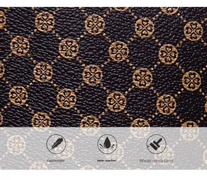 Detailed view of water-resistant synthetic leather with gold clover floral pattern