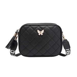 Black quilted crossbody bag with white butterfly buckle and jacquard shoulder strap