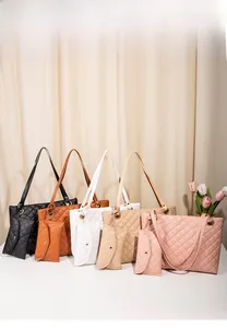Detail view of multi-color quilted tote bags set with matching small coin purses