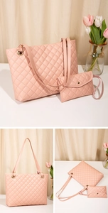 Detail of pink quilted tote bag set with golden hardware and matching pouch