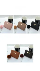 Showcase of women's mini wallets with wave patterns and matching plush ball charms