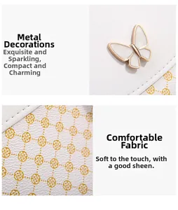 Detailaufnahme von weißem Blumenleder und einer goldenen Schmetterlingsschnalle an der Tasche