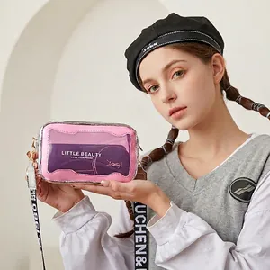 Petit sac bandoulière rose transparent avec sangle imprimée et bordure argentée