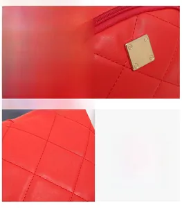 Detail of red quilted faux leather and gold square hardware on women backpack