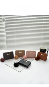 Women's short wallets in five colors with wave stitching and furry ball charms