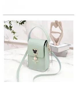 Detailed size parameters of the light green small crossbody bag with metal charms