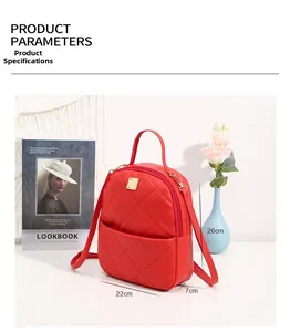 Detail view of red quilted mini backpack with dimensions 26cm x 22cm x 7cm and metal logo