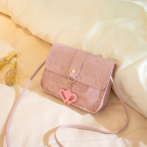 Pink embossed small square crossbody bag with cartoon patterns and heart pendants