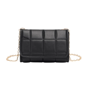 Classic black padded quilted chain bag with elegant gold metal strap on white background