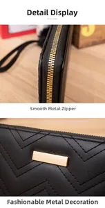 Close-up of golden zipper hardware and V-shaped chevron stitching on black long wallet