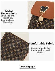 Detail of vintage crossbody phone bag featuring clover pattern and mouse shape metal lock